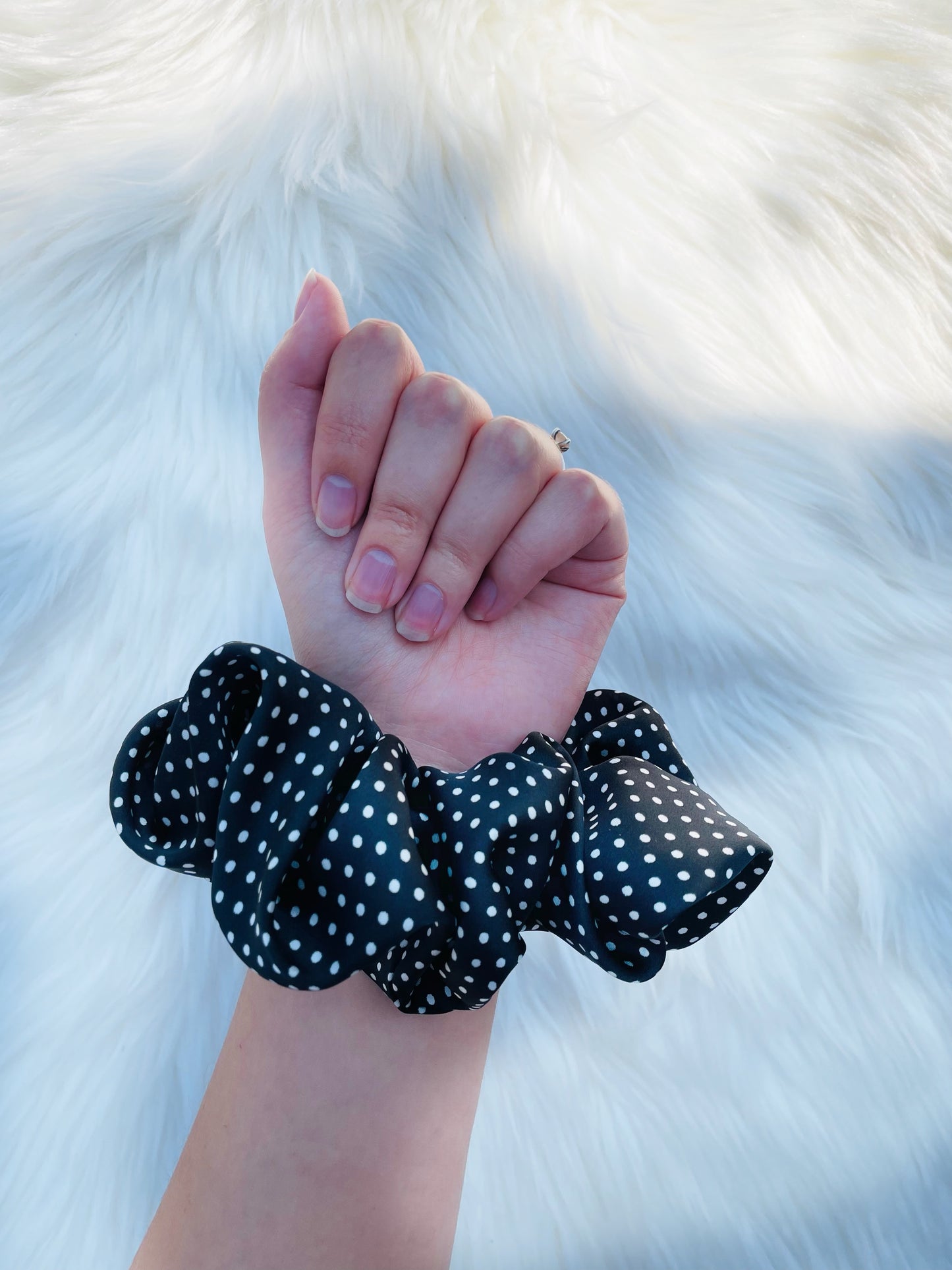 LEILANI |EMI AND CO | black satin polka dot scrunchie on wrist