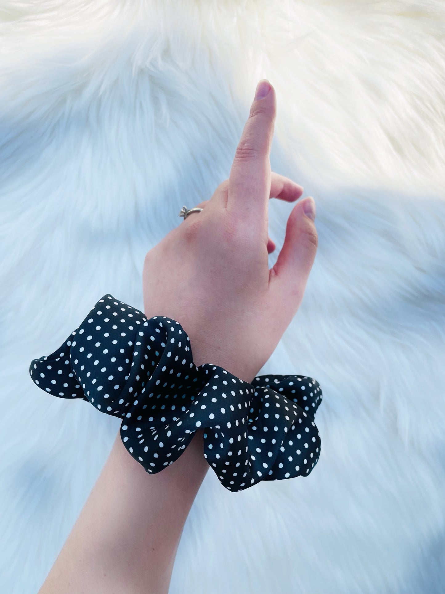LEILANI |EMI AND CO | black satin polka dot scrunchie on wrist