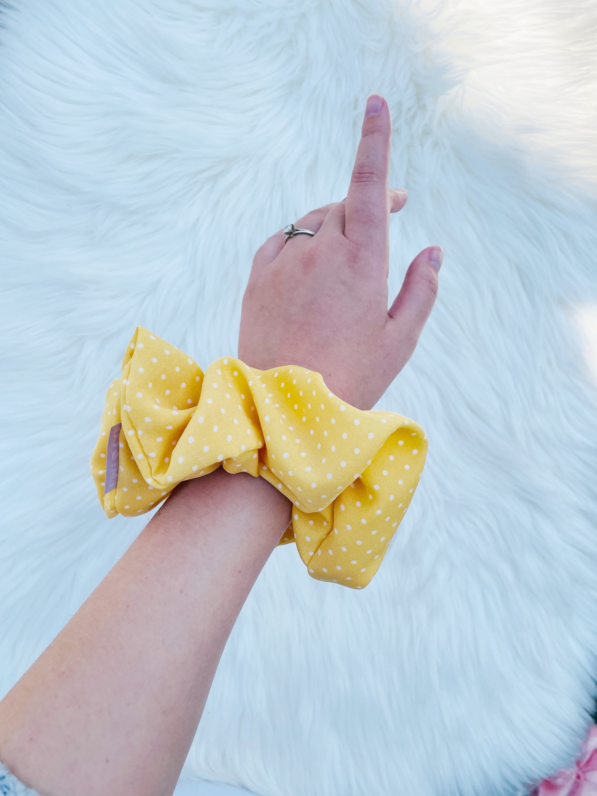 AURELIA| EMI AND CO | yellow polka dot scrunchie on wrist 