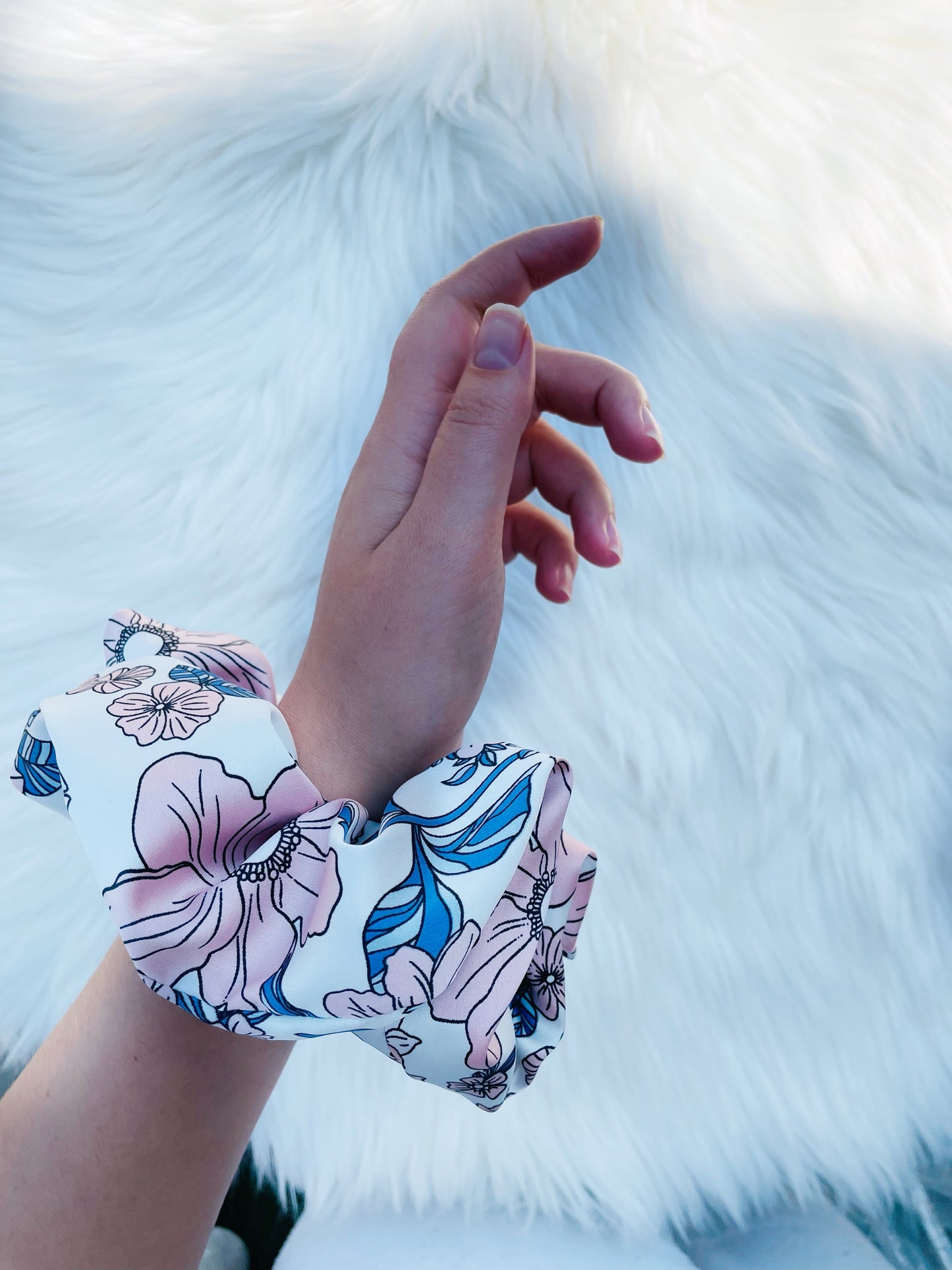 EMALINE | EMI AND CO | floral blue and pink scrunchie on wrist 