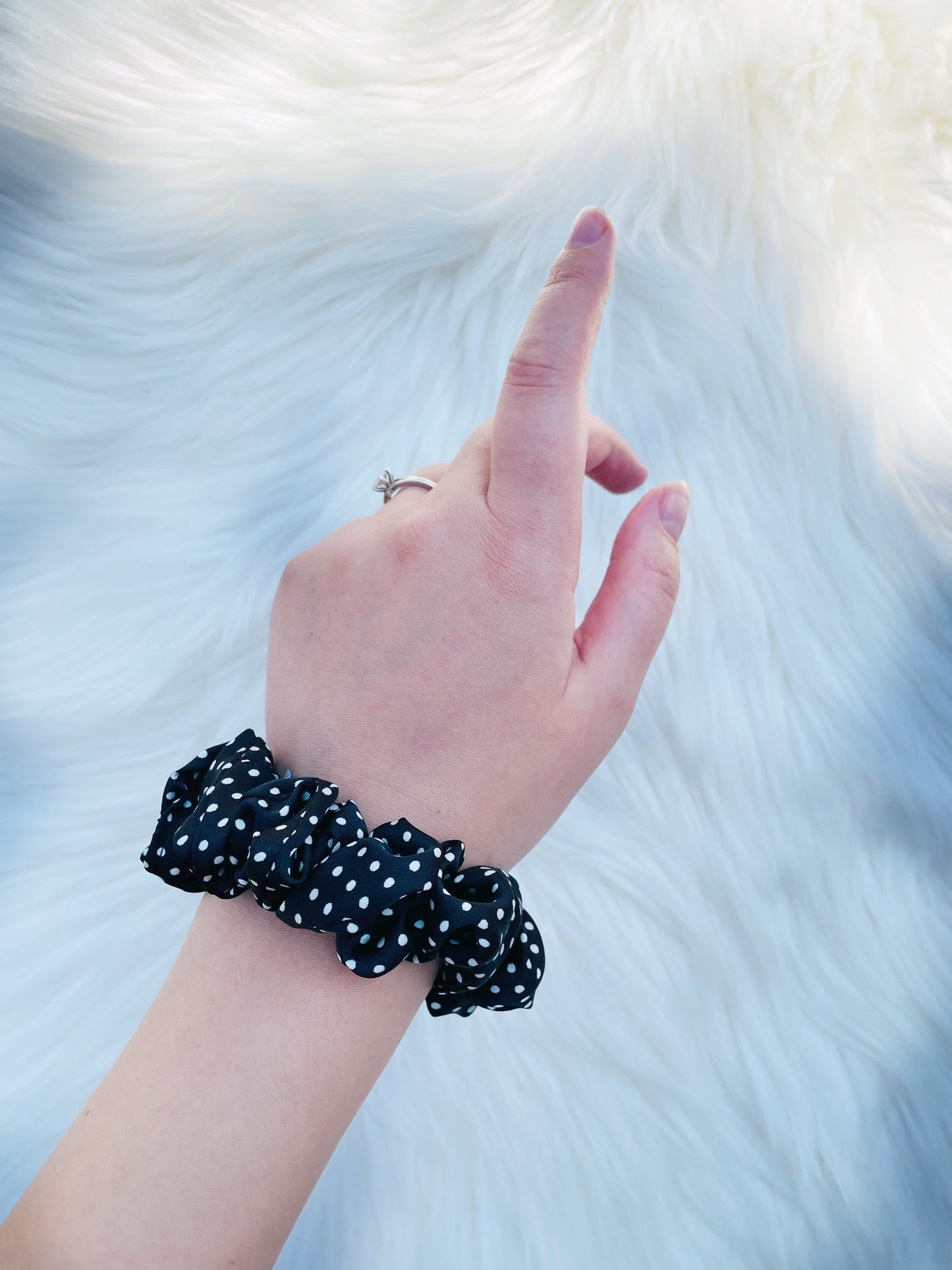 LEILANI MINI |EMI AND CO | mini black satin polka dot scrunchie on wrist 