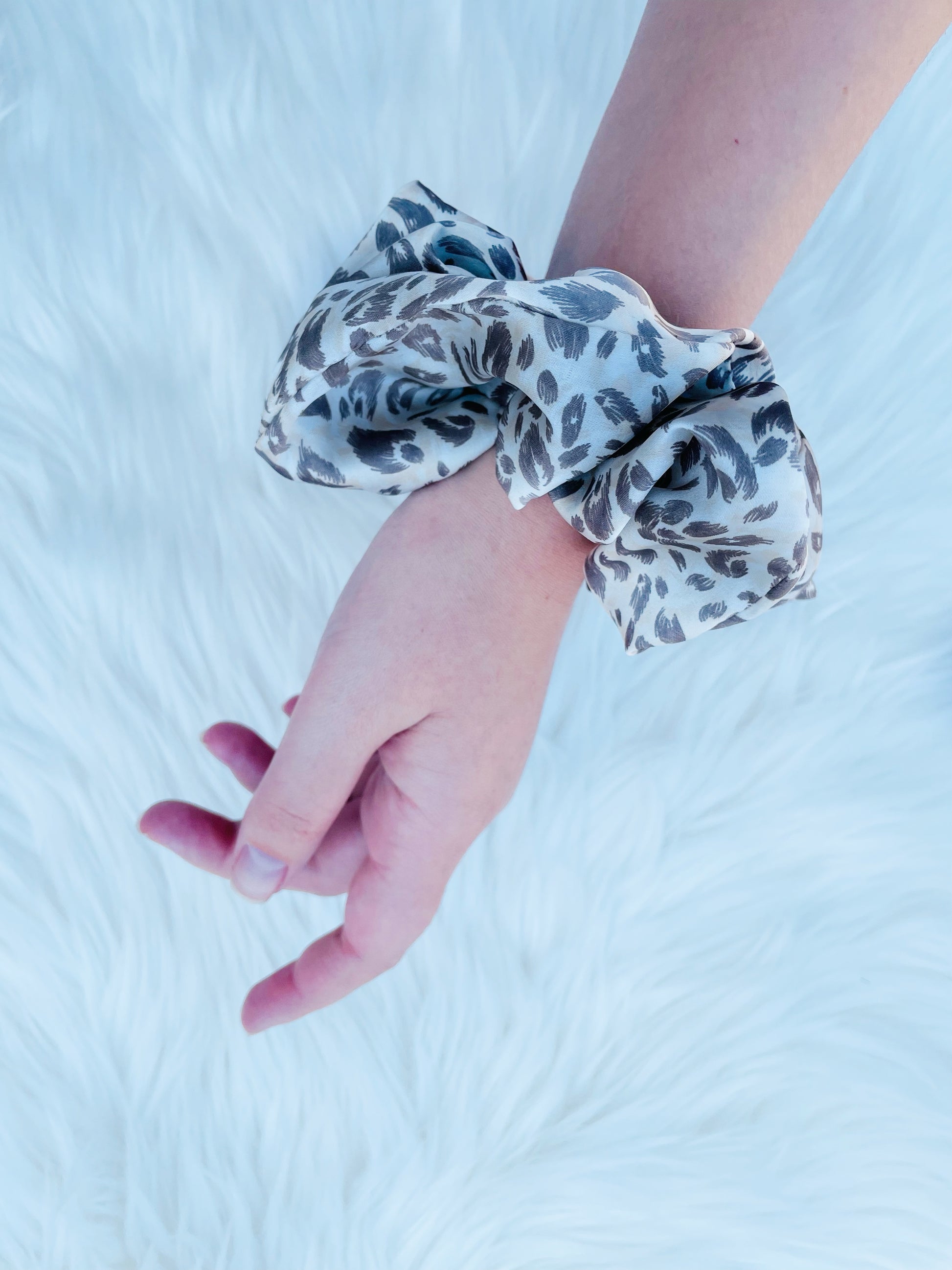 Leopard print satin scrunchie on hand| EMI AND CO | AMITY 