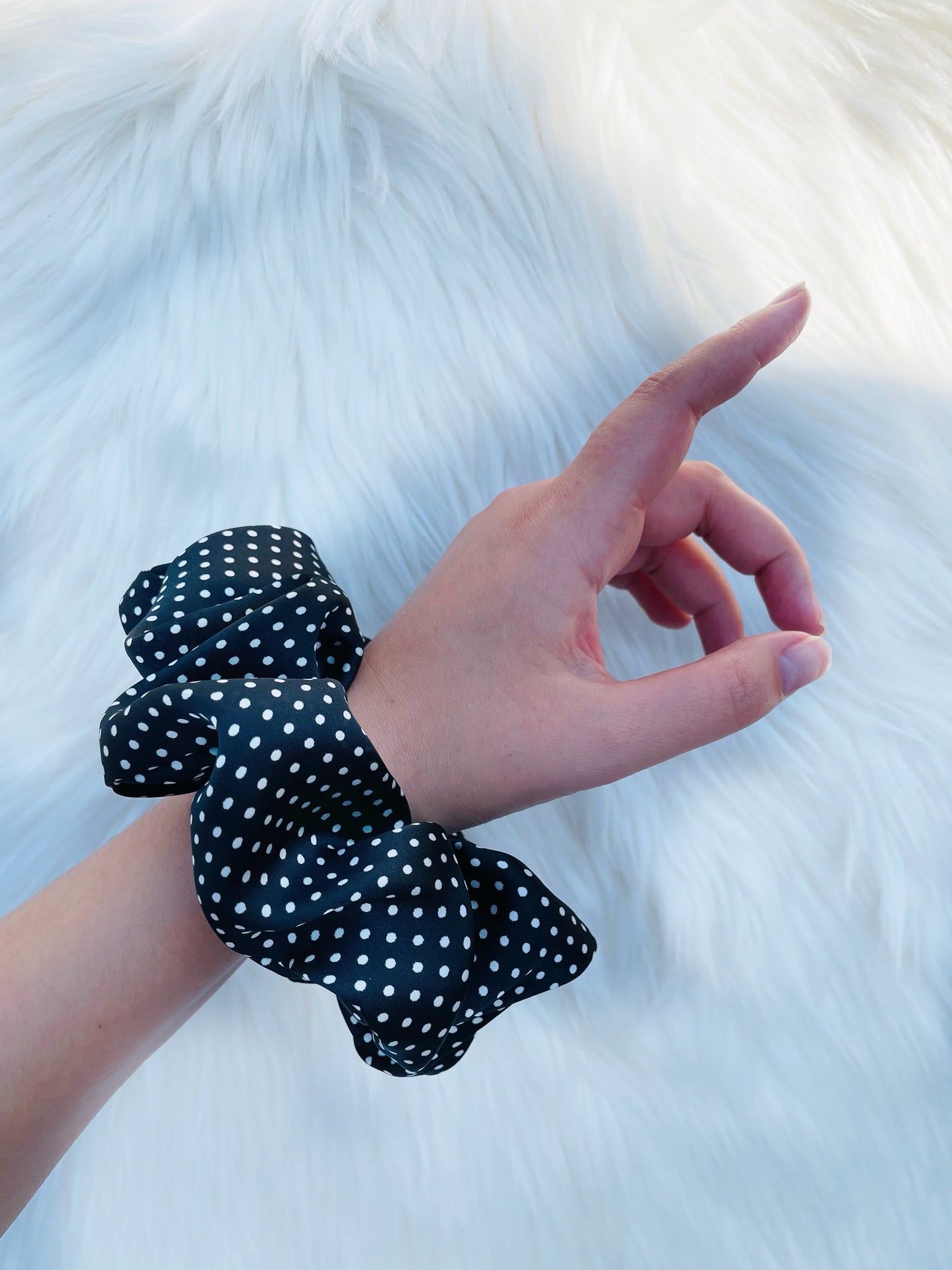 LEILANI |EMI AND CO | black satin polka dot scrunchie on wrist 