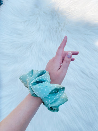 CHASITY | EMI AND CO | green satin polka dot scrunchie on wrist 