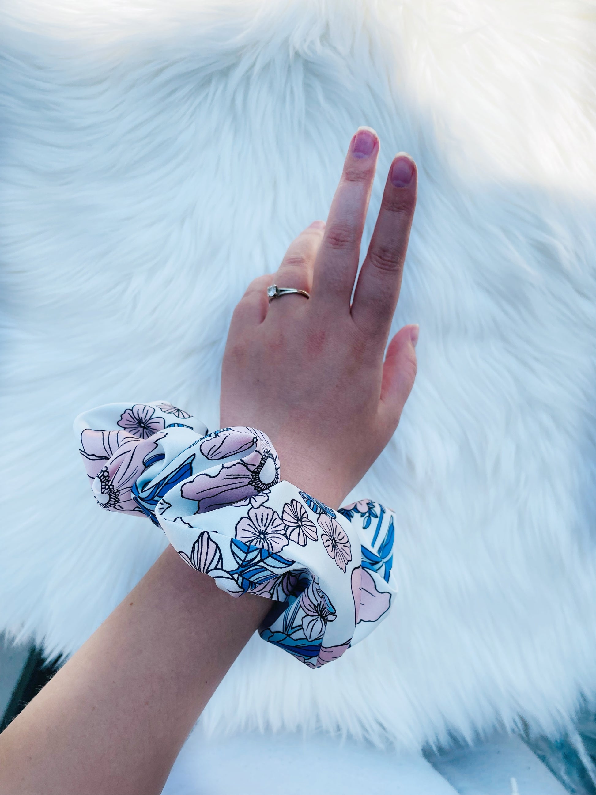 EMALINE| EMI AND CO | floral blue and pink scrunchie on wrist 