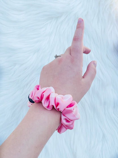 CAROLINA MINI | EMI AND CO | mini satin pink scrunchie on wrist 