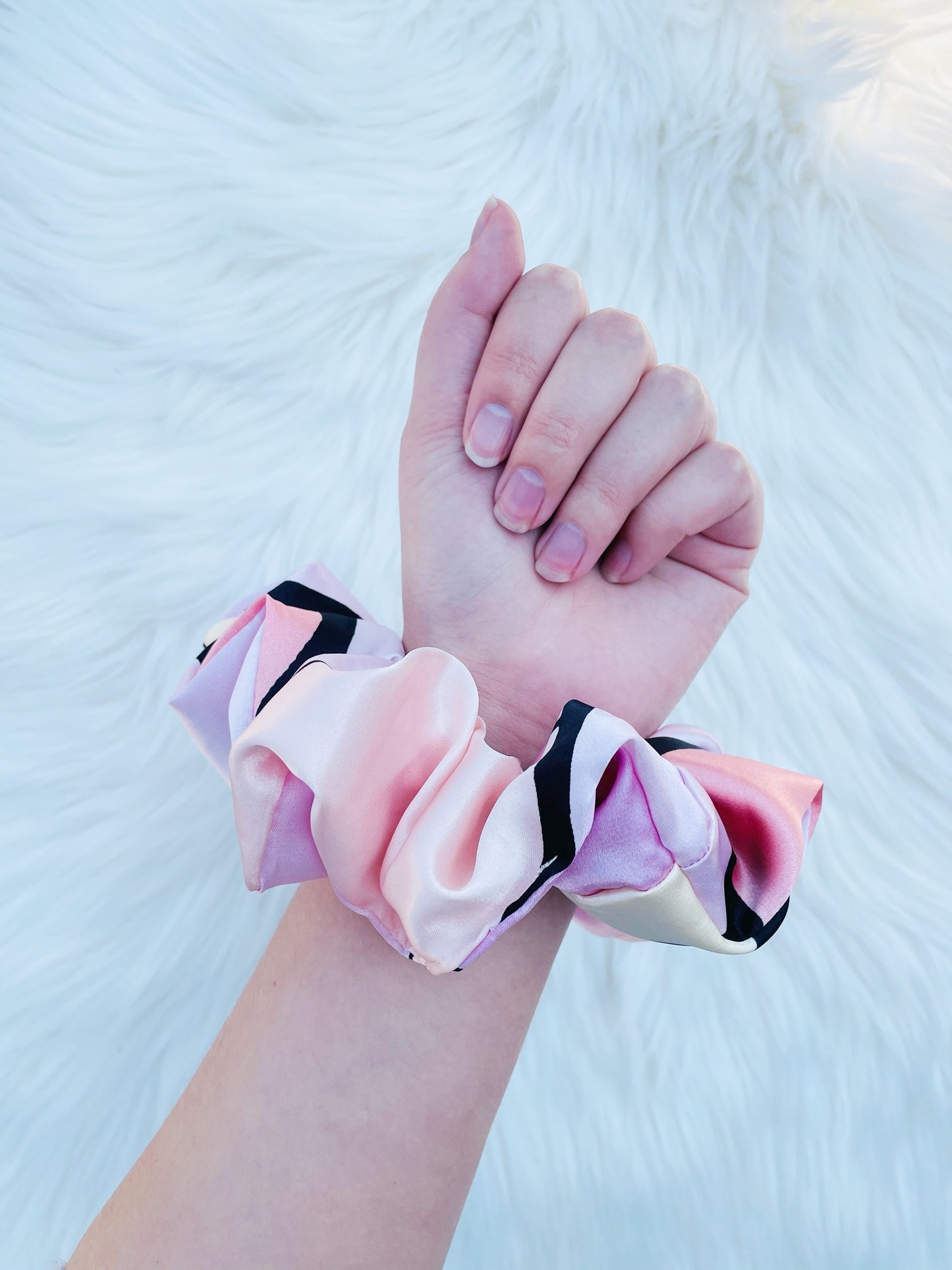 SCOUT| EMI AND CO | pink pattern satin scrunchie on wrist 