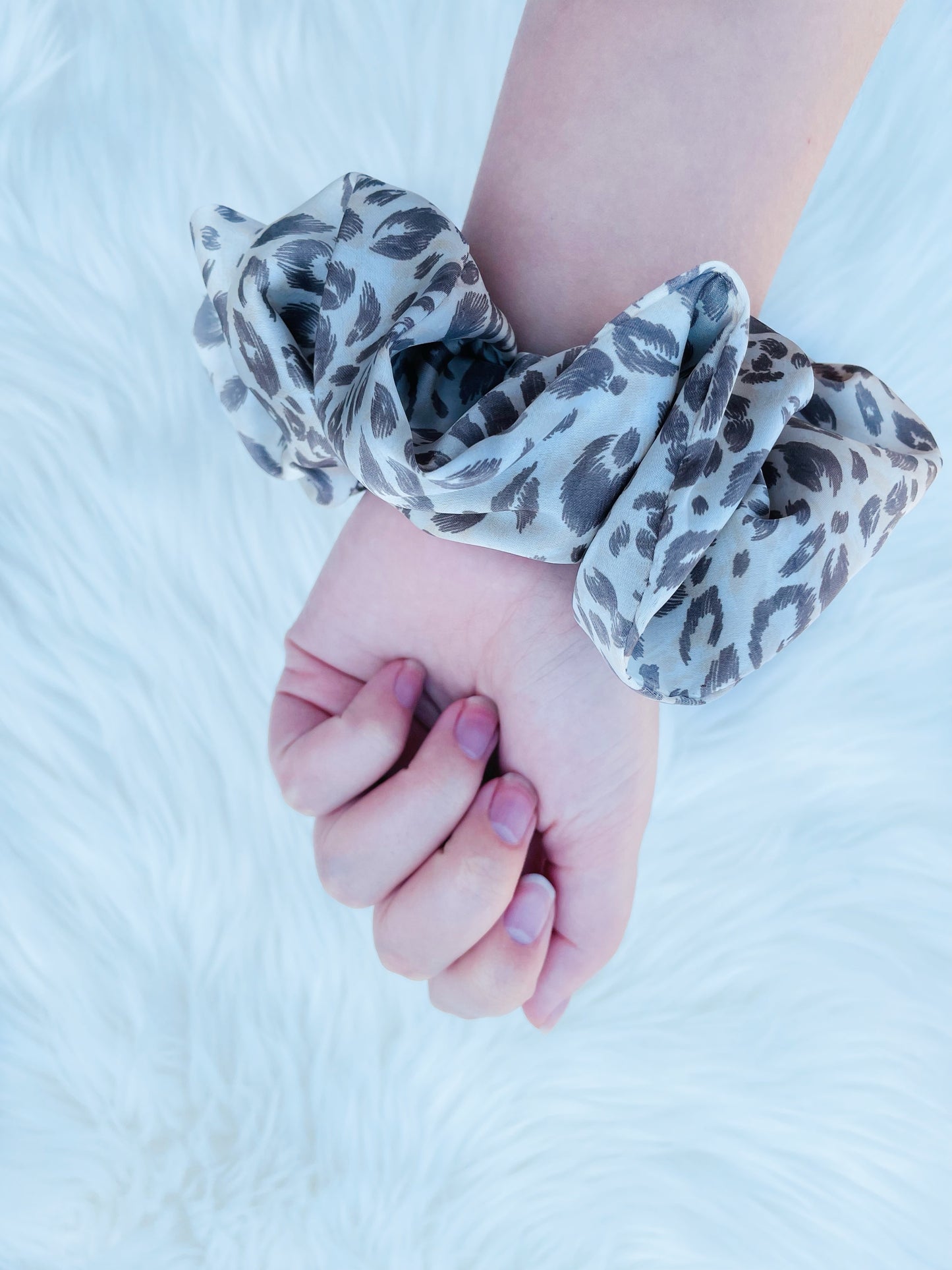 Leopard print satin scrunchie on hand| EMI AND CO | AMITY 