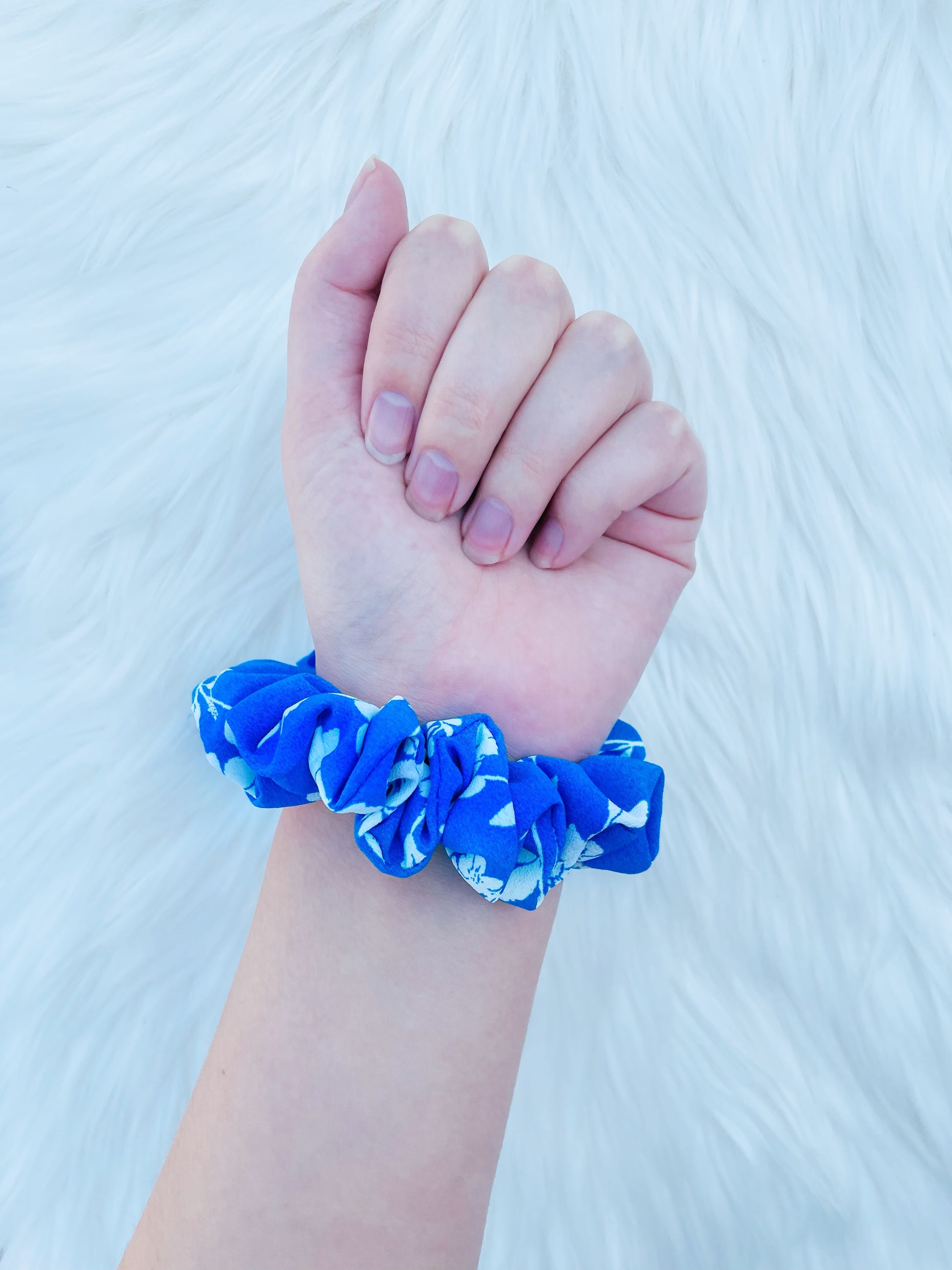 DOROTHY | EMI AND CO | white and blue mini floral scrunchie on wrist 