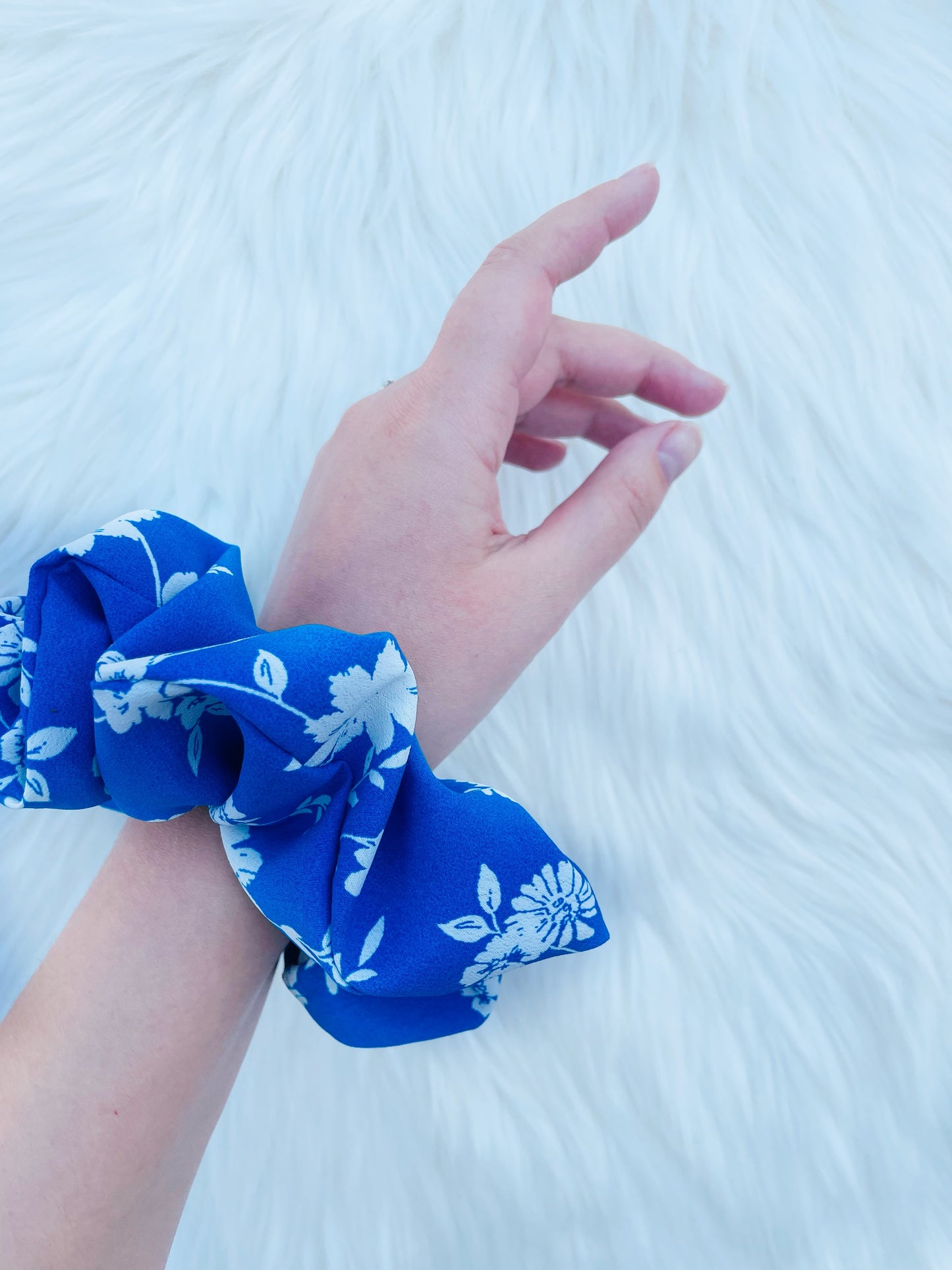 DOROTHY | EMI AND CO | blue and white floral scrunchies on wrist