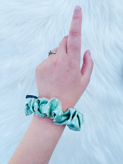 CHASITY MINI | EMI AND CO | mini green satin scrunchie on wrist 