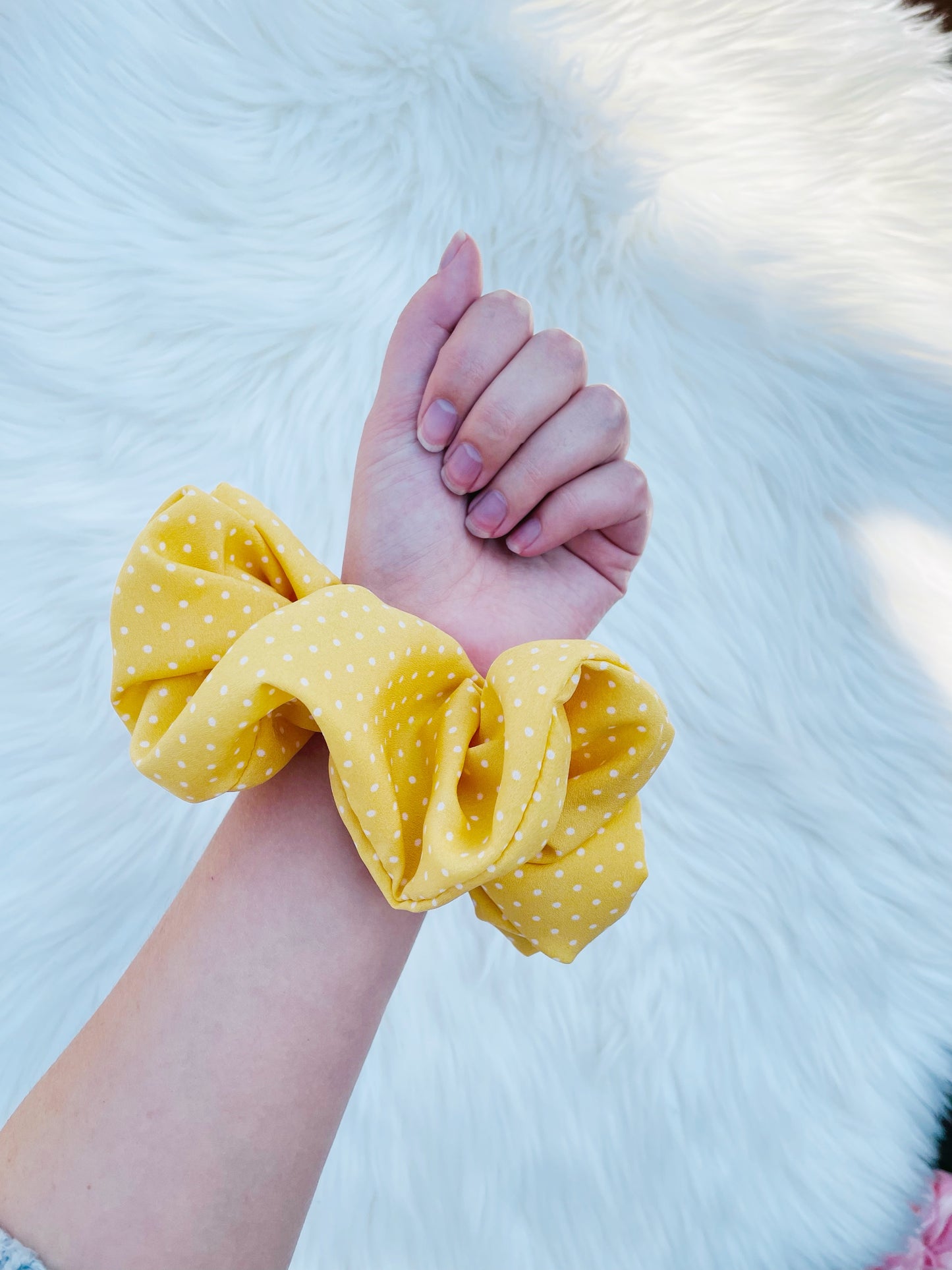 AURELIA | EMI AND CO | yellow polka dot scrunchie on wrist 