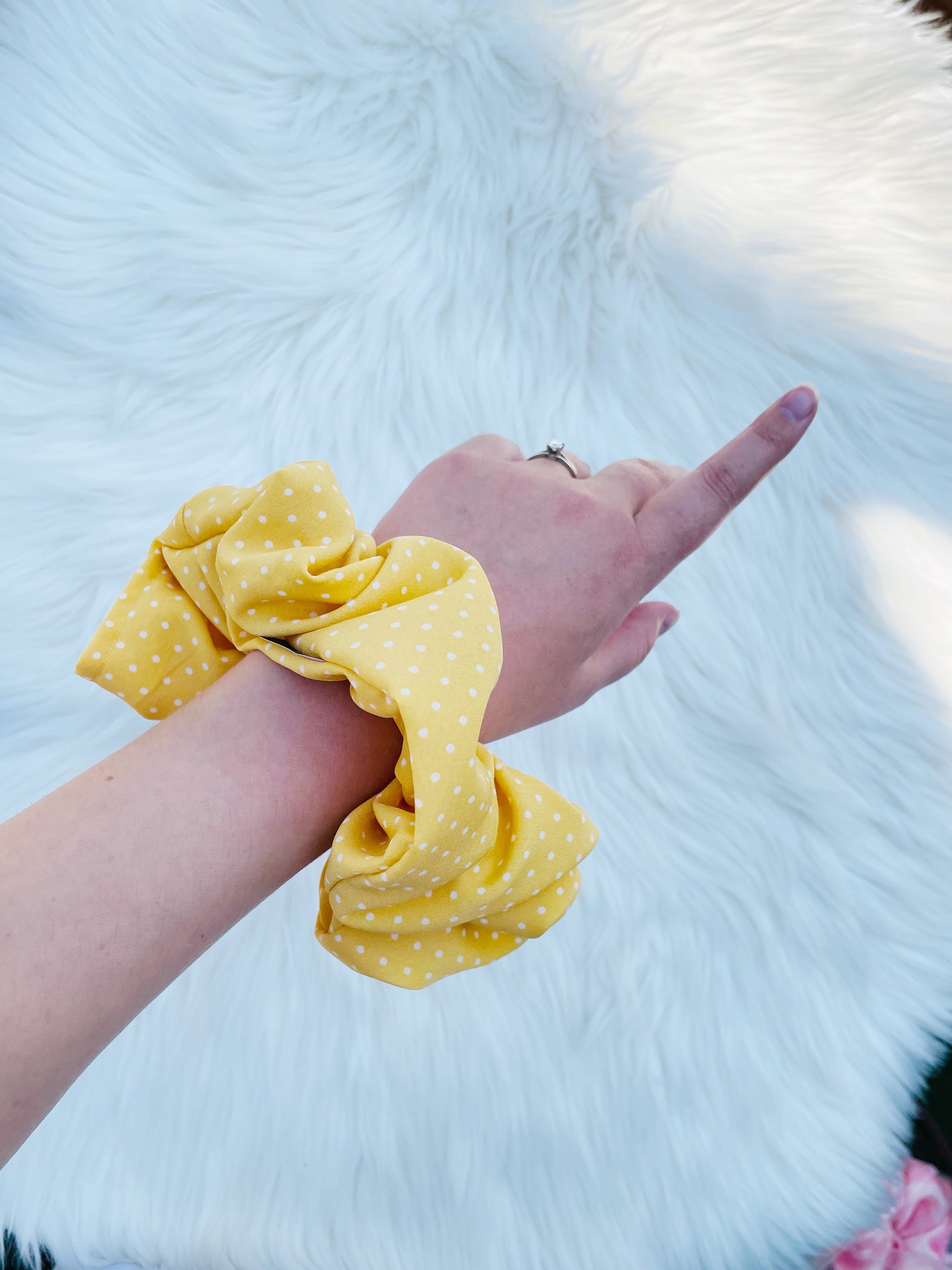 AURELIA | EMI AND CO | yellow polka dot scrunchie on wrist 