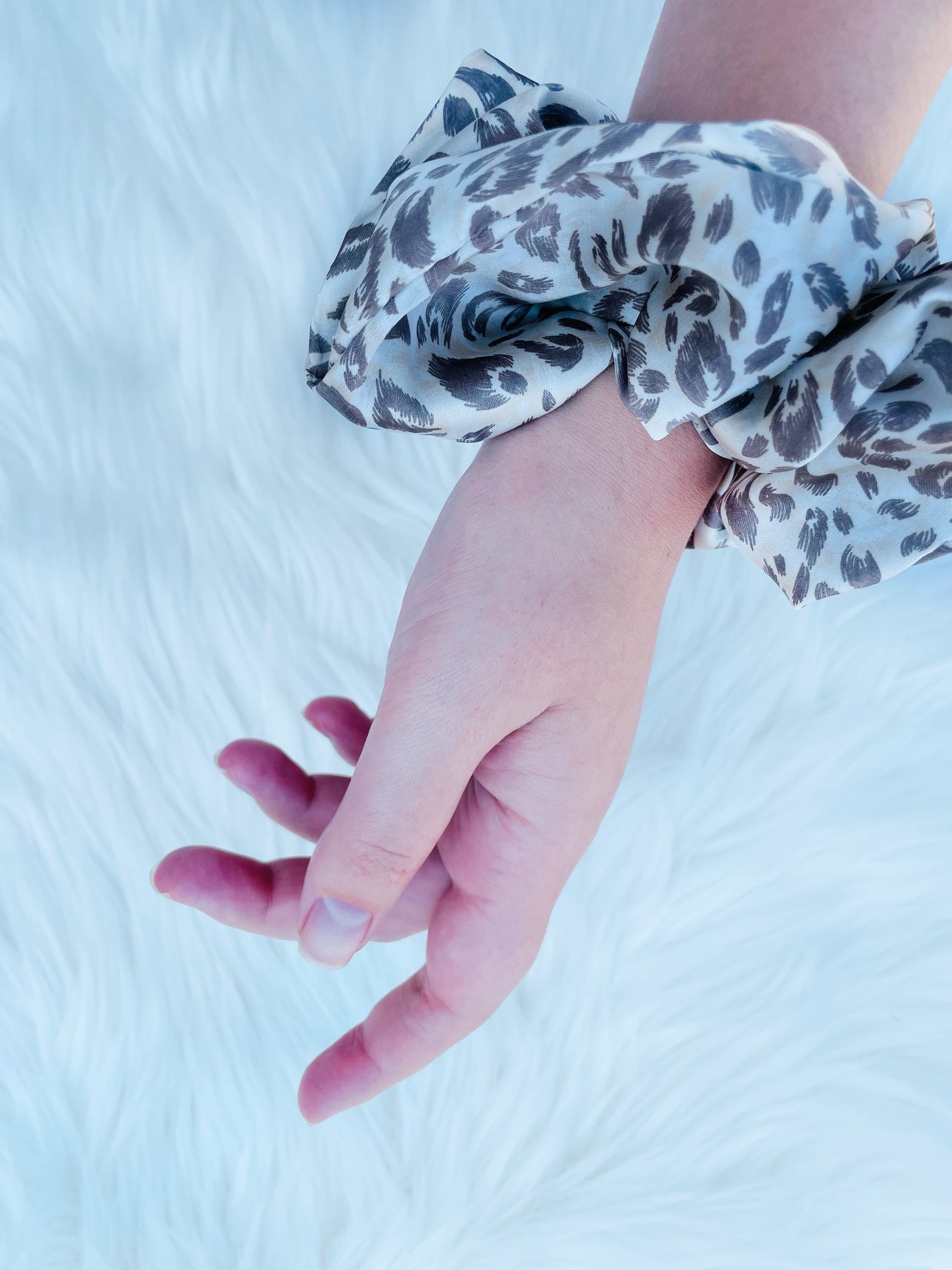 Leopard print satin scrunchie on hand| EMI AND CO | AMITY 