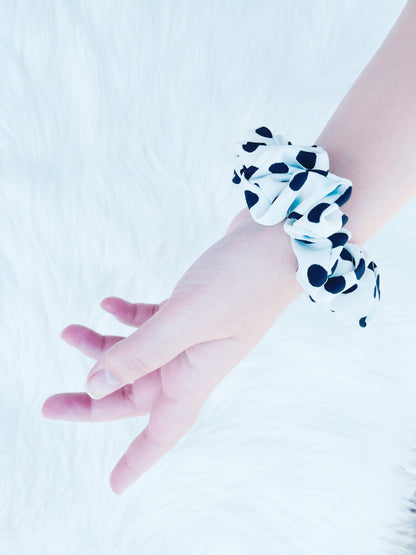 ANGELINA MINI | EMI AND CO | mini black and white polka dot scrunchie on wrist 