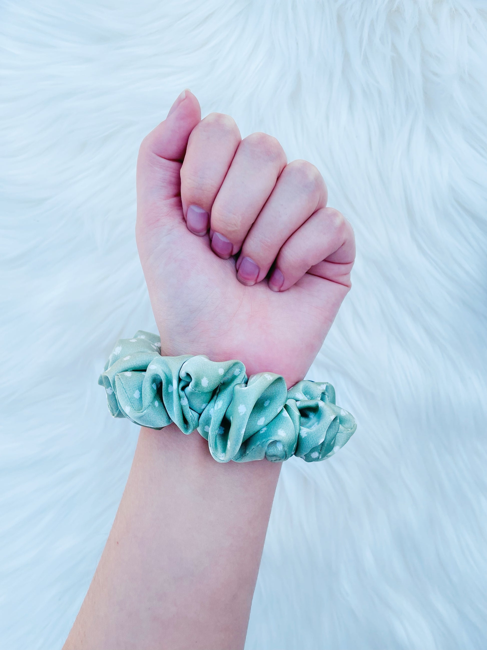 CHASITY MINI | EMI AND CO | mini green satin scrunchie on wrist 