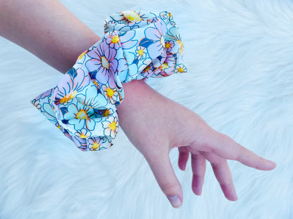 REAGAN| EMI AND CO | floral pink and green scrunchie on wrist 