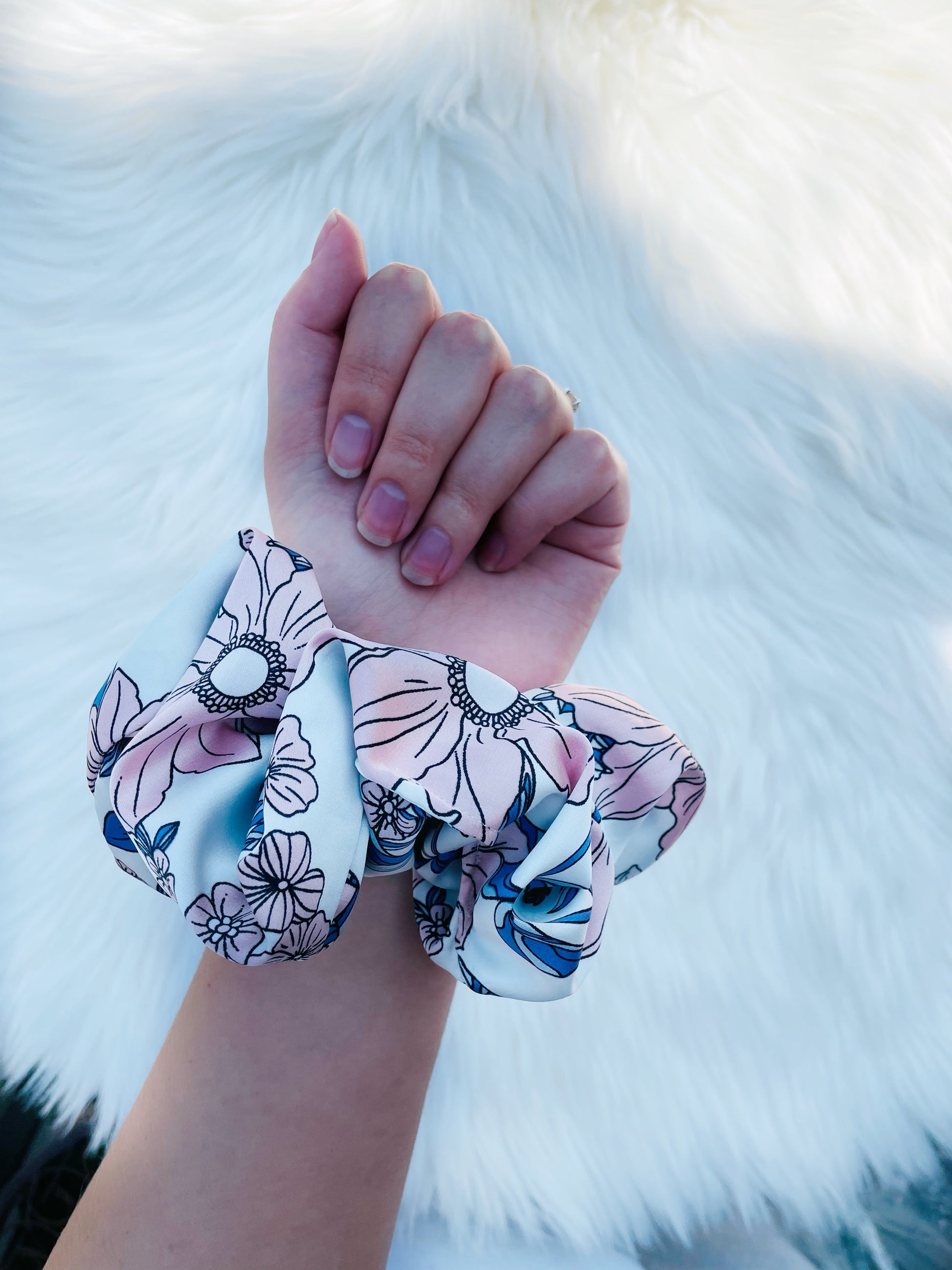 EMALINE | EMI AND CO | floral blue and pink scrunchie on wrist 