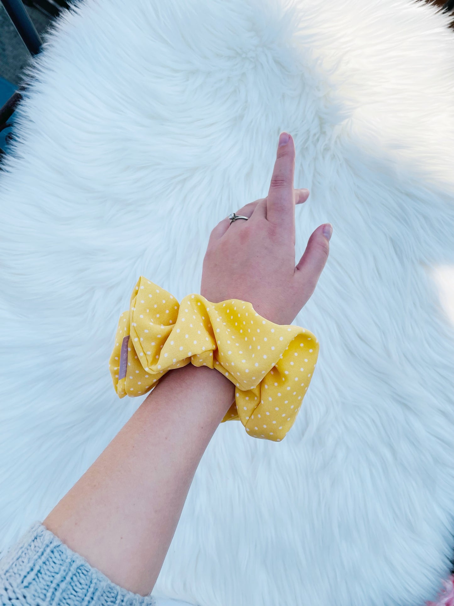 AURELIA | EMI AND CO | yellow polka dot scrunchie on wrist 