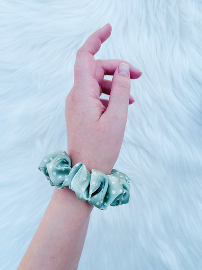 CHASITY MINI | EMI AND CO | mini green polka dot scrunchie on wrist 