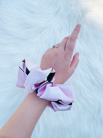 SCOUT| EMI AND CO | pink pattern satin scrunchie on wrist 