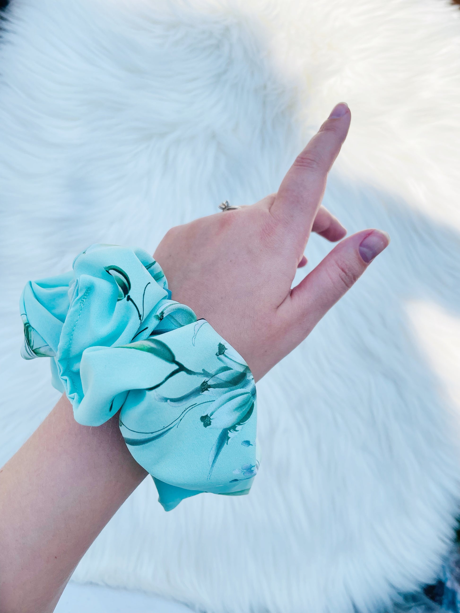 JOAN| EMI AND CO | green floral scrunchie on wrist 