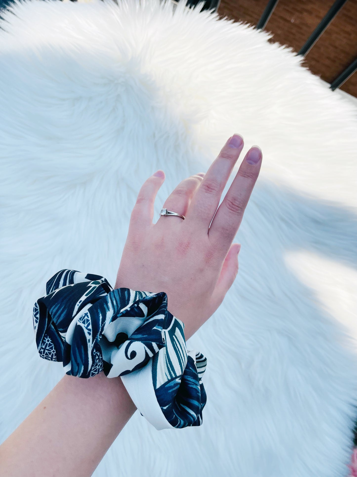 GUINEVERE|EMI AND CO| Black and white pattern scrunchie on wrist 