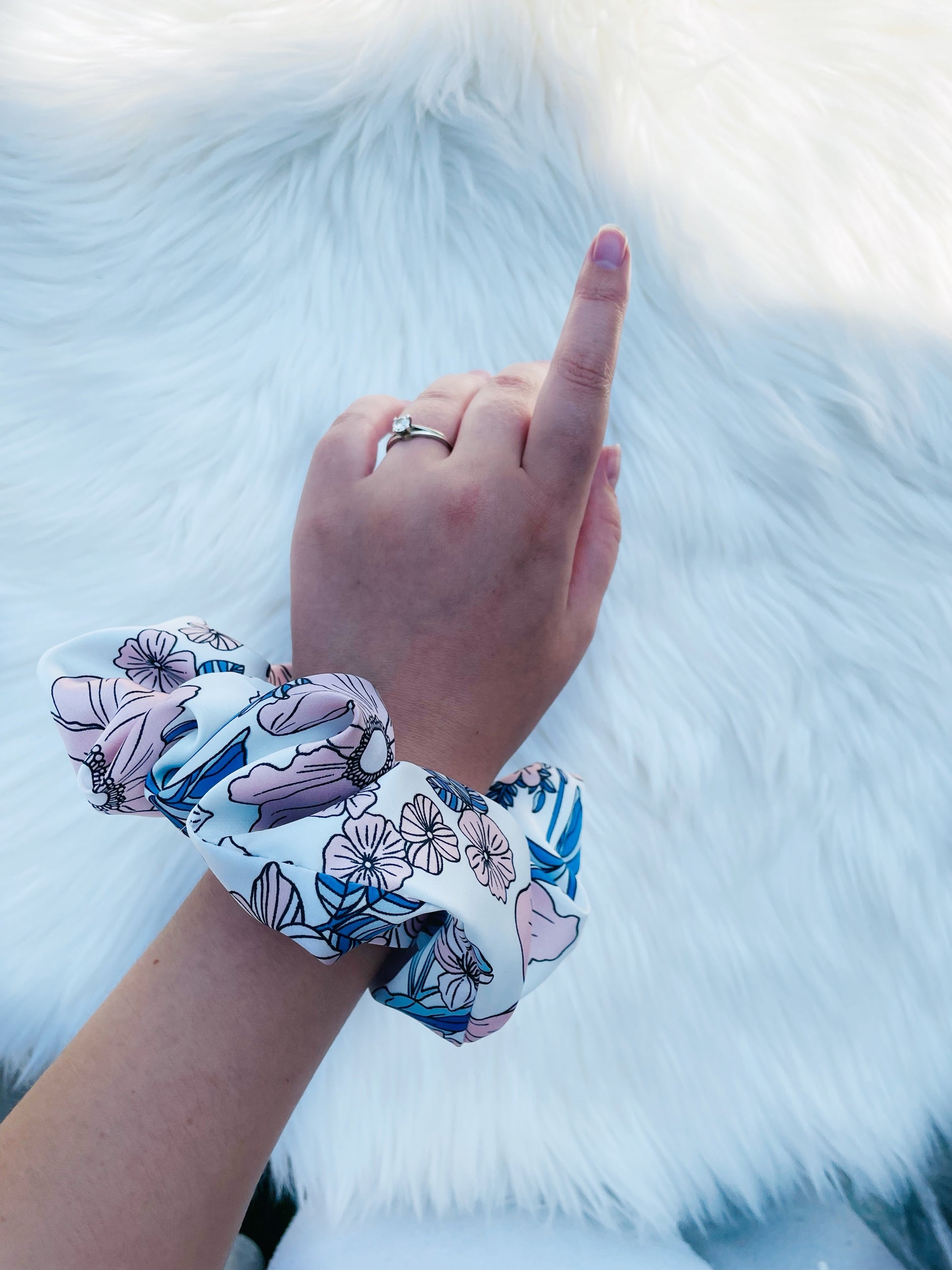 EMALINE| EMI AND CO | floral blue and pink satin scrunchie on wrist 