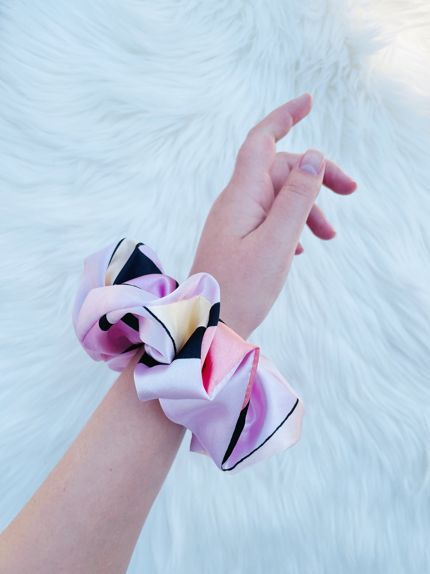 SCOUT| EMI AND CO | pink pattern satin scrunchie on wrist 