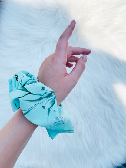 JOAN| EMI AND CO | green floral scrunchie on wrist 