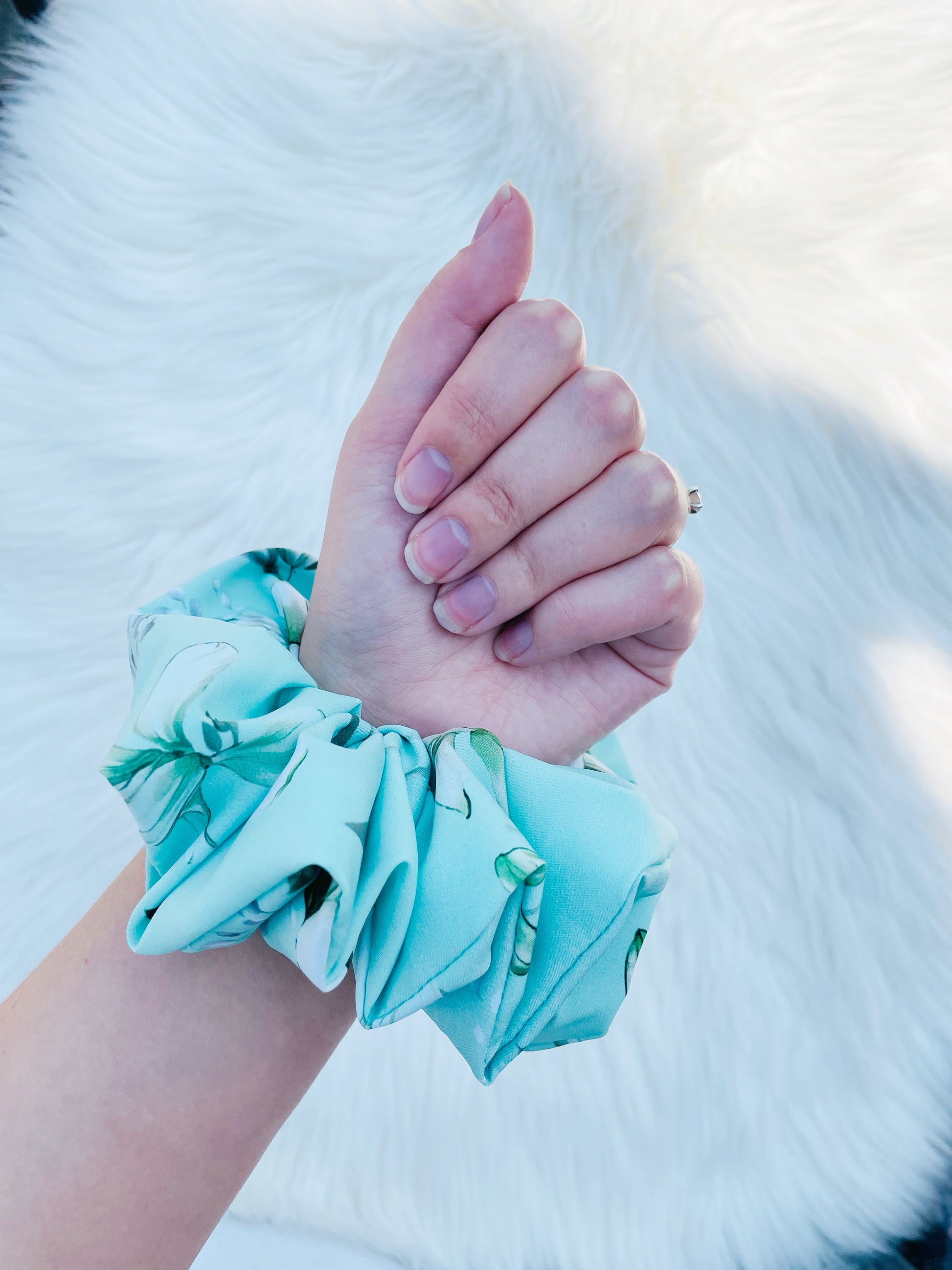 JOAN| EMI AND CO | green floral scrunchie on wrist 