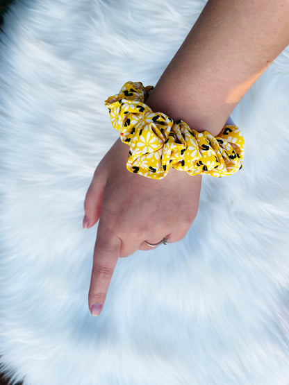 ZARI MINI| EMI AND CO |mini yellow floral scrunchie on wrist 