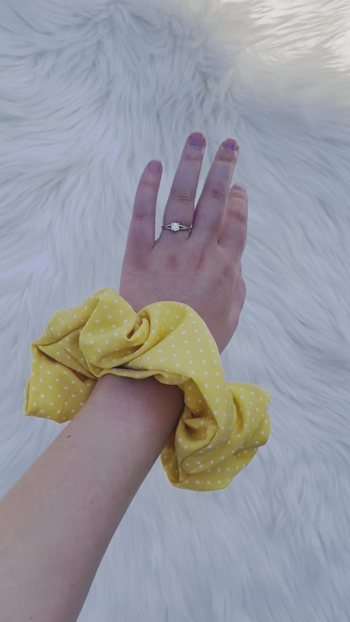 AURELIA | EMI AND CO | yellow polka dot scrunchie on wrist 