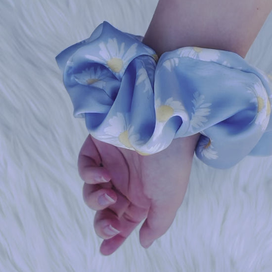 DAKOTA| EMI AND CO | blue satin floral scrunchie on wrist 