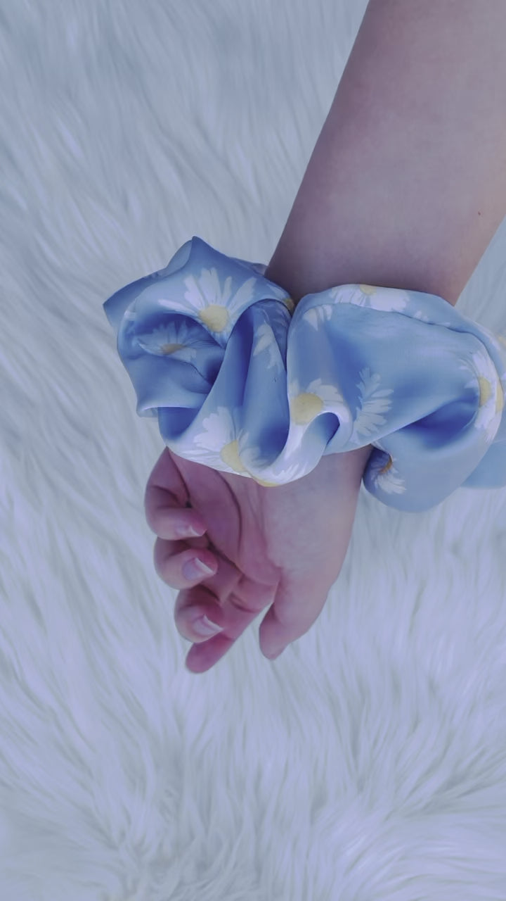 DAKOTA| EMI AND CO | blue satin floral scrunchie on wrist 