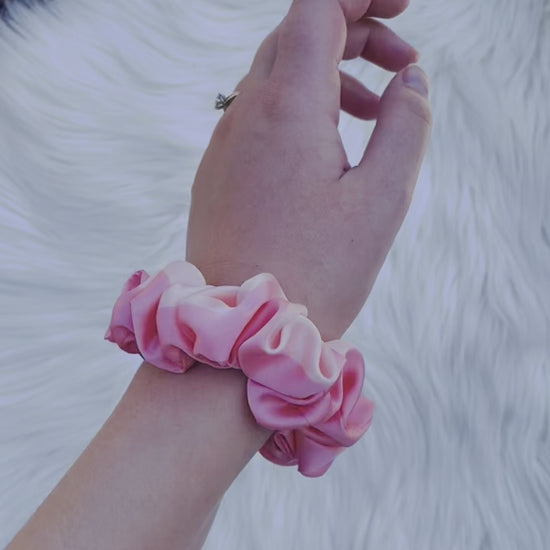 CAROLINA MINI | EMI AND CO | mini pink satin scrunchie on wrist 