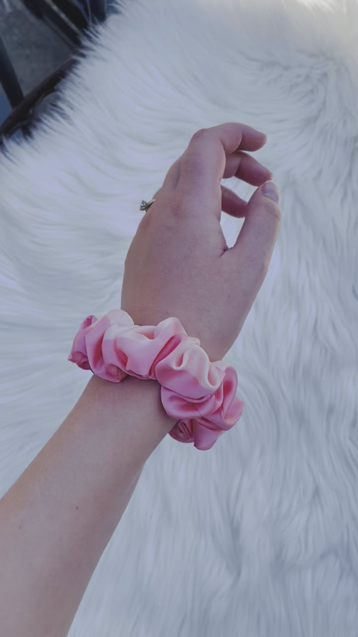 CAROLINA MINI | EMI AND CO | mini pink satin scrunchie on wrist 