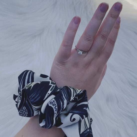 GUINEVERE|EMI AND CO| Black and white pattern scrunchie on wrist