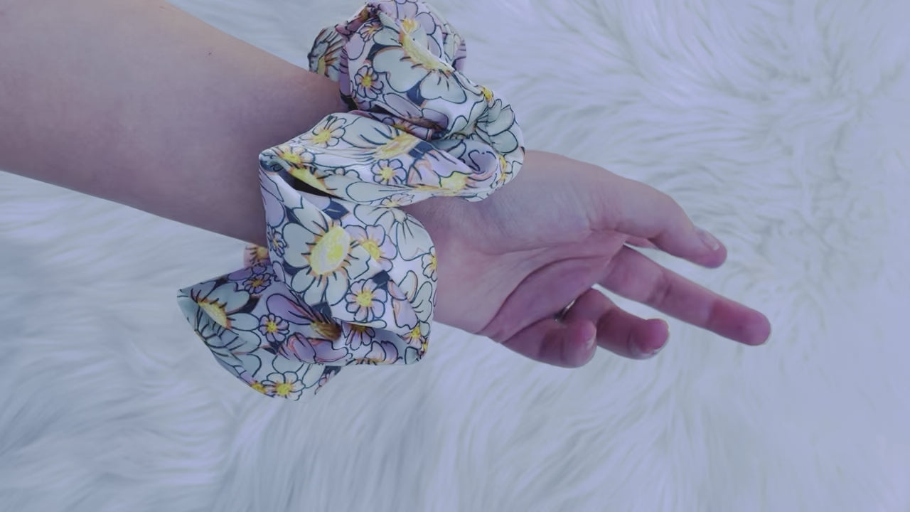 REAGAN| EMI AND CO | floral pink and green scrunchie on wrist 