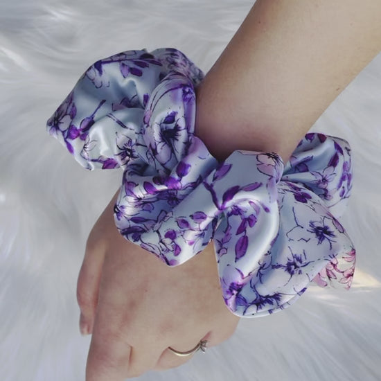 YOLANDA| EMI AND CO | floral purple satin scrunchie on wrist 