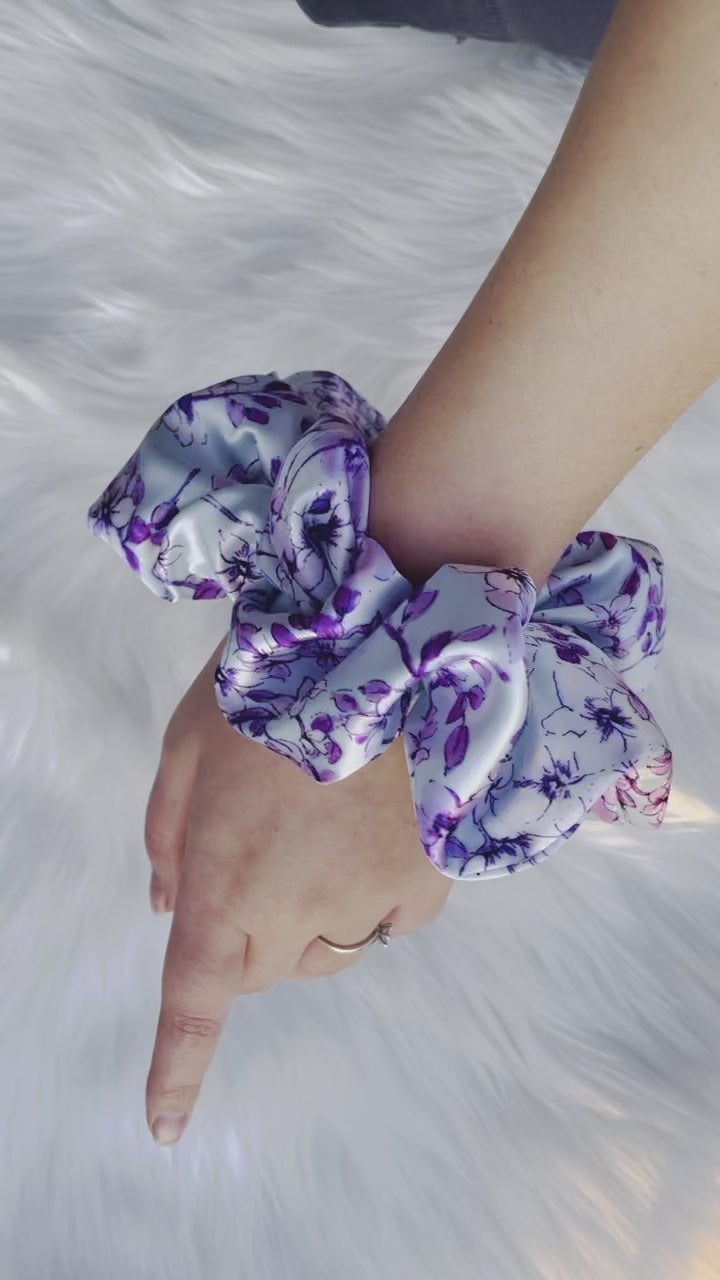 YOLANDA| EMI AND CO | floral purple satin scrunchie on wrist 