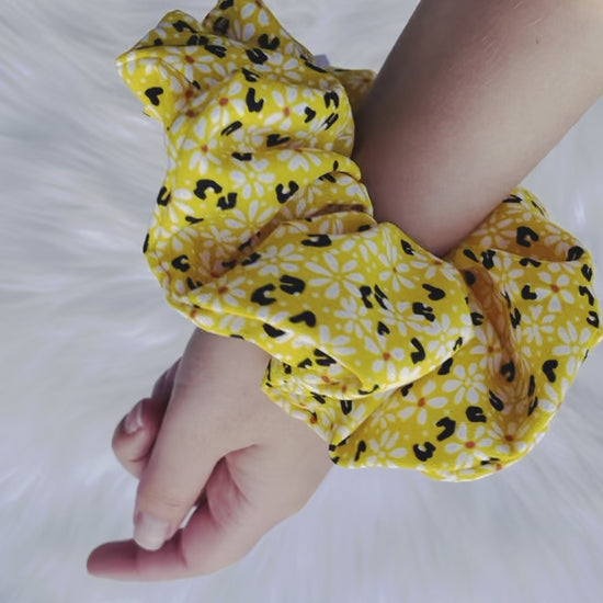 ZARI | EMI AND CO | yellow floral scrunchie on wrist 