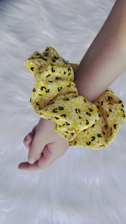 ZARI | EMI AND CO | yellow floral scrunchie on wrist 