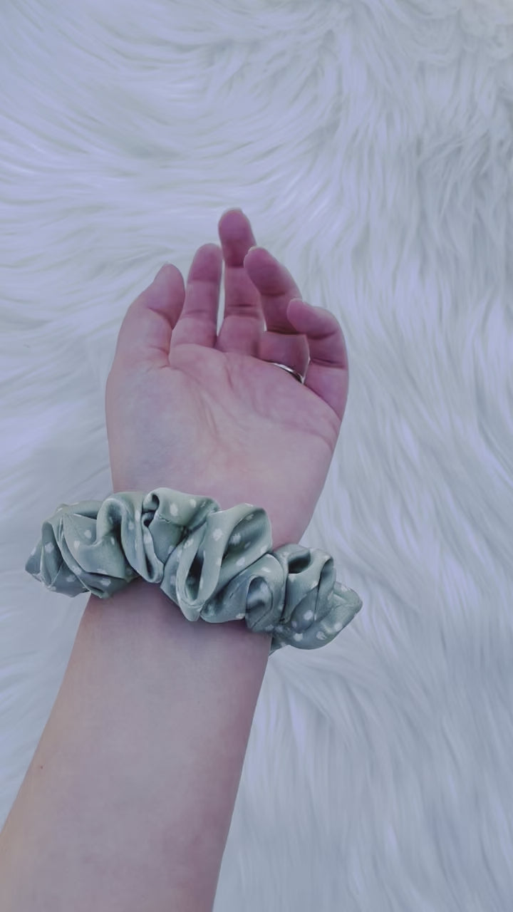 CHASITY MINI | EMI AND CO | mini green satin scrunchie on wrist 