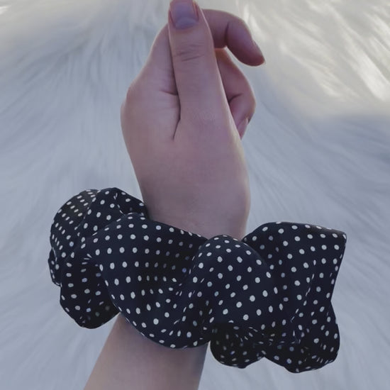 LEILANI |EMI AND CO | black satin polka dot scrunchie on wrist 