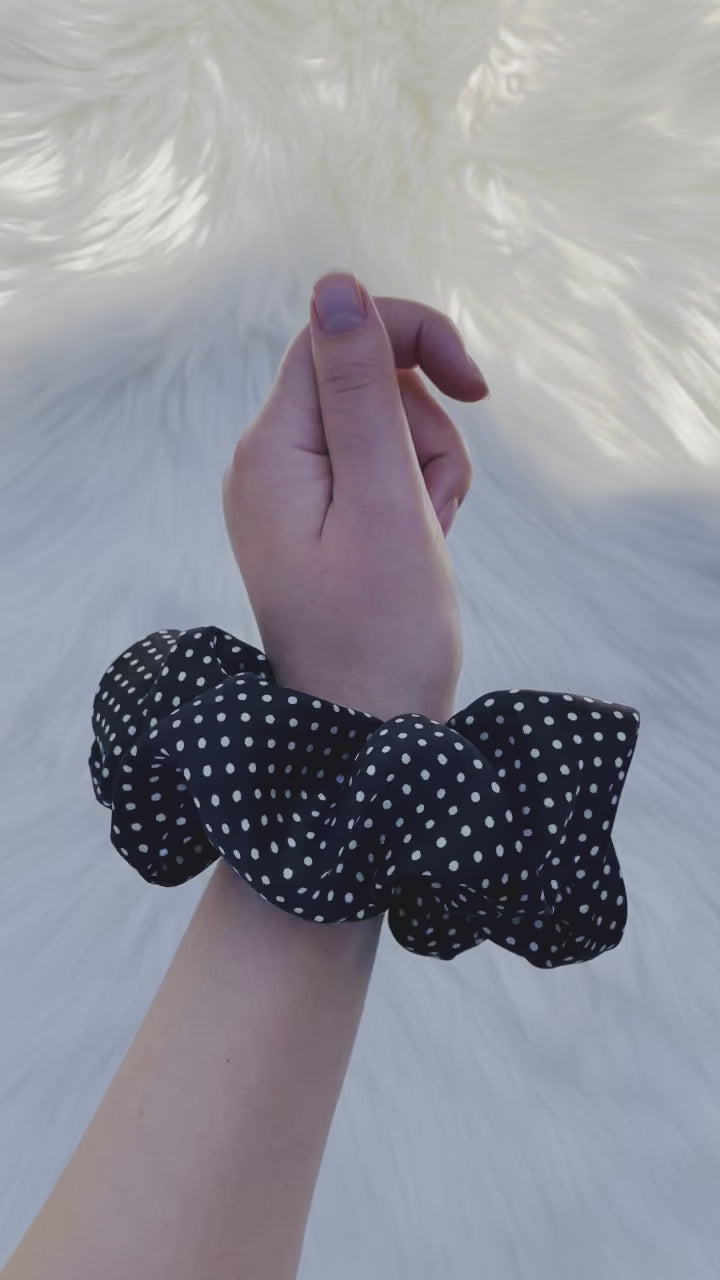 LEILANI |EMI AND CO | black satin polka dot scrunchie on wrist 