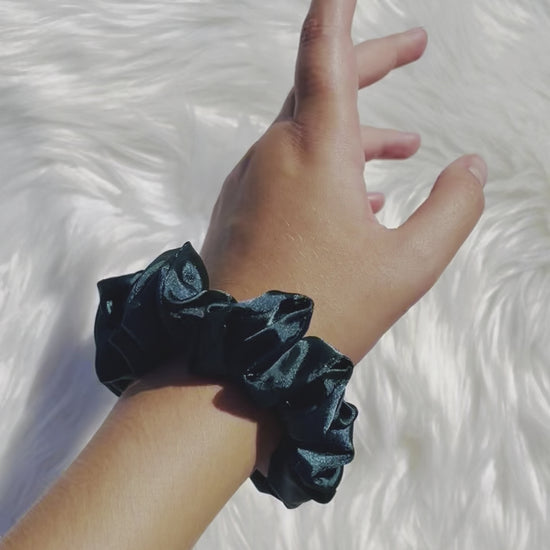 DOVA MINI | EMI AND CO | mini green satin scrunchie on wrist 