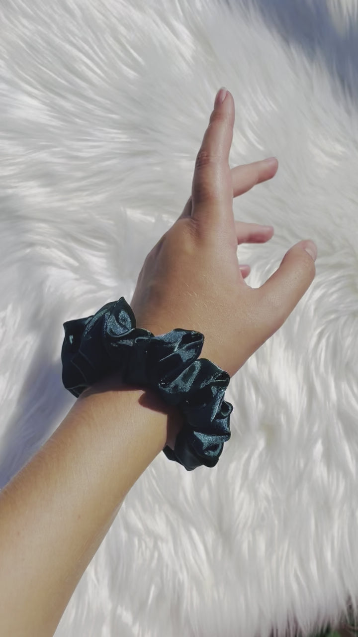 DOVA MINI | EMI AND CO | mini green satin scrunchie on wrist 