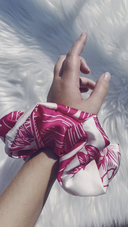 ITZAYANA| EMI AND CO | Pink and white floral satin scrunchie on wrist 