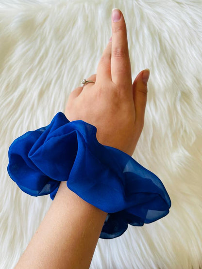 royal blue oversized chiffon scrunchie on wrist | EMI & CO | KAYLEE